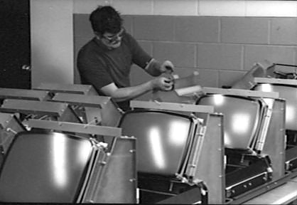 LTI technician hand-assembling Genesys 5000 gamma counters on the production line, c. 1986