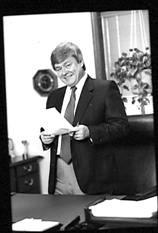 Donald L. Oesterlin, founder of Laboratory Technologies, at his desk, c. 1986