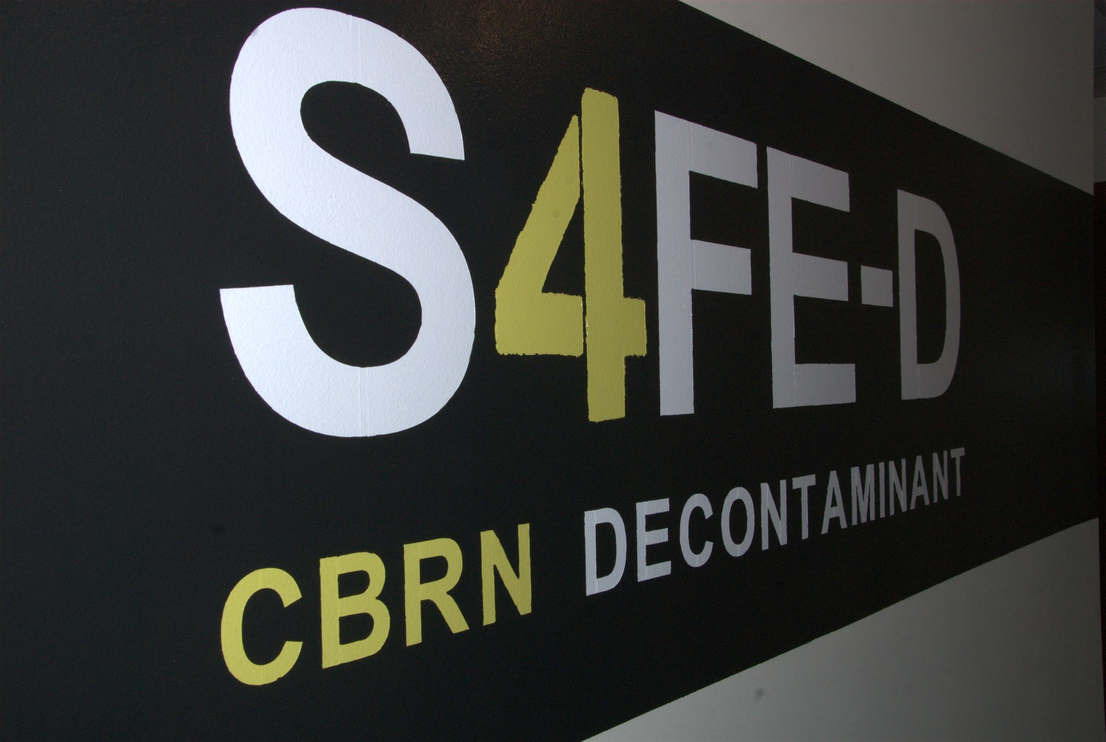 The S4FE-D® brand mural at the LTI facility — three decades of clinical chemistry, rebuilt and re-branded for the CBRN response community
