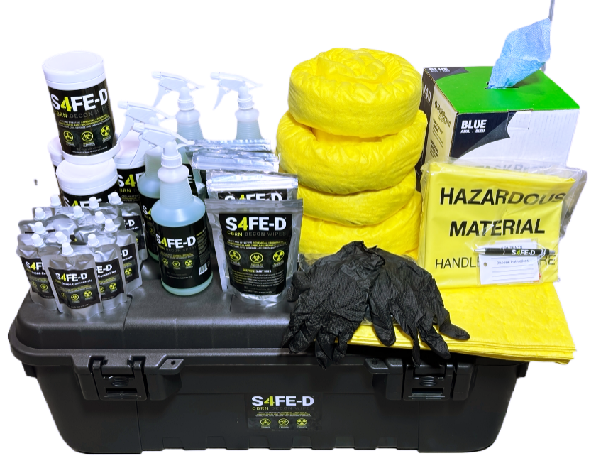The S4FE-D Decon Response Kit — a black Plano Sportsman's Trunk loaded with S4FE-D spray bottles, wipes canisters, concentrate refill pouches, hazmat absorbent socks and pads, hazardous waste bags, nitrile gloves, and shop towels.